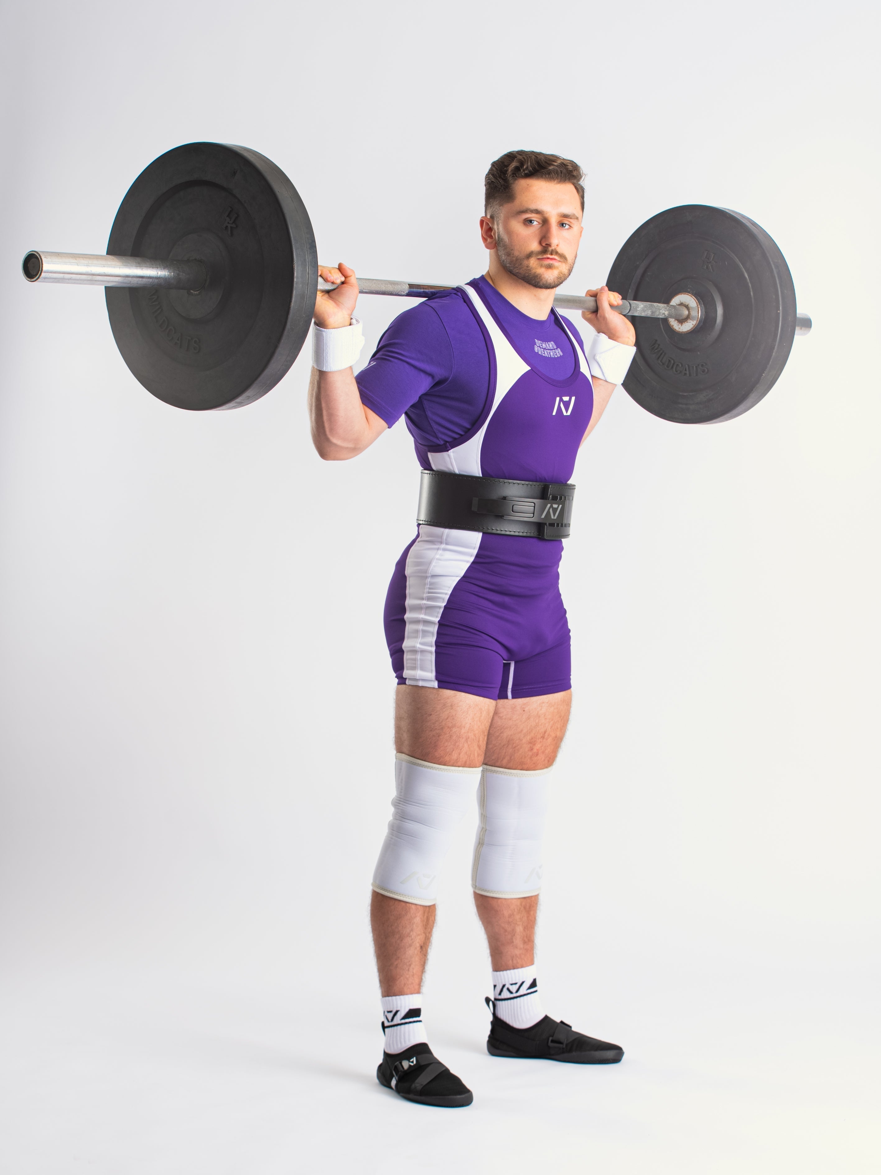 A7 IPF Approved Purple Luno singlet features extra lat mobility, side panel stitching to guide the squat depth level and curved panel design for a slimming look. The Women's cut singlet features a tapered waist and additional quad room. The IPF Approved Kit includes Luno Powerlifting Singlet, A7 Meet Shirt, A7 Zebra Wrist Wraps, A7 Deadlift Socks, Hourglass Knee Sleeves. Genouill�res powerlifting shipping to France, Spain, Ireland, Germany, Italy, Sweden and EU.